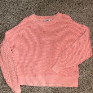 Waffle knit pink sweater.